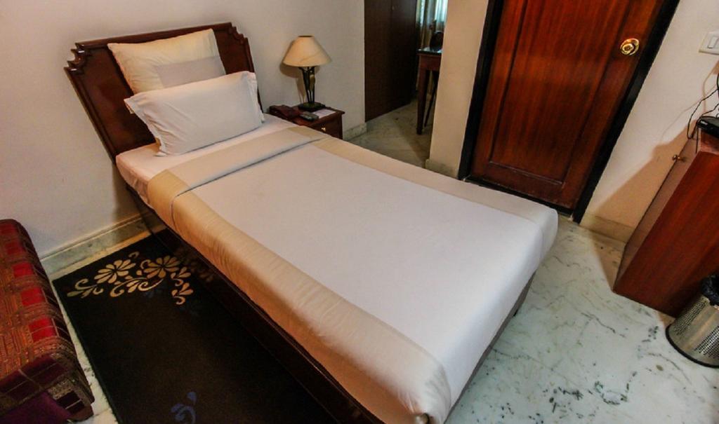 Hotel Pigeon International バンガロール 部屋 写真